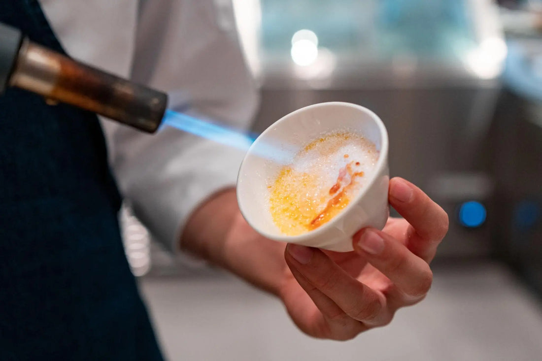 caramelizing sugar on creme brulee using kitchen blow torch